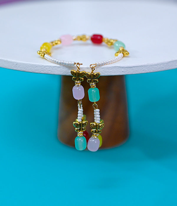 Mixed-coloured pearls and beads rakhi
