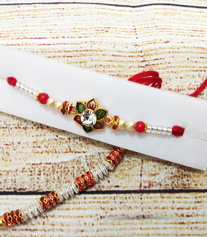 Designer Flower and Pearl Rakhi & 1 Red and Silver Bead Rakhi - Set of 2