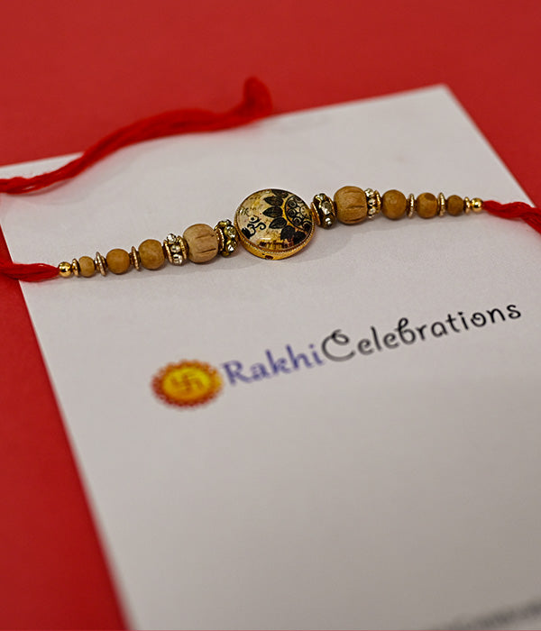 Classic Om Rakhi With Wooden Beads